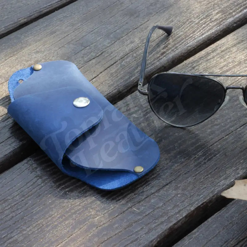Blue leather sunglasses case in a premium slim leather eyeglass and sunglasses case