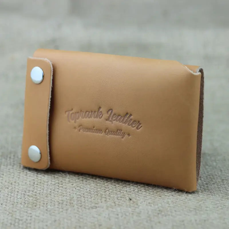 Tan leather card wallet with snap closure from Trisnap Fold, a handmade minimalist leather wallet