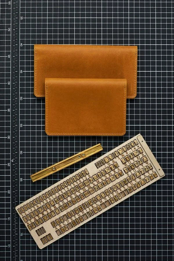 Blue leather luggage tag from personalized leather accessories collection.