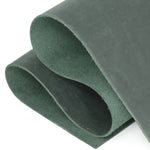 A close-up of a dark green textured material roll, showing the thickness and suede-like surface texture against a white background. 