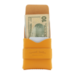 Yellow leather wallet with a card slot and money pocket on a white background 