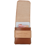 A brown leather card holder wallet with an open top flap, showing a card partially inserted. A tan leather band around the middle is embossed with the brand name 'Toprank Leather'. 