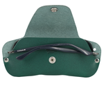 Green eyeglass case with a pair of black glasses inside on a white background 