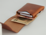 Gable leather flap wallet in Crazy Camel open, holding cards and banknotes flat under the flap. 