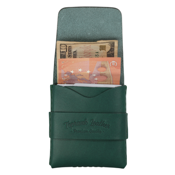 A dark green leather passport holder wallet with a strap closure and embossed 'Terraku Leather' branding, shown open with banknotes tucked into the interior slots against a plain white background. 
