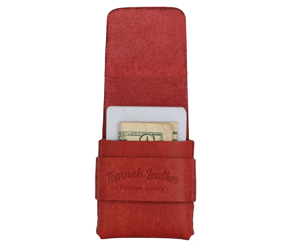 A red leather money clip wallet with a US dollar bill partially inserted, featuring the embossed brand name 'Toprank Leather' on the front strap, set against a plain white background. 