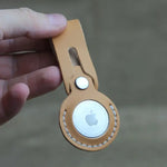 Handcrafted full-grain leather Airtag holder with secure snap-button closure