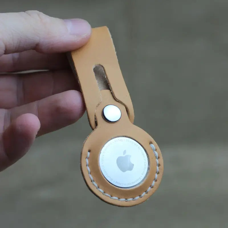 Handcrafted full-grain leather Airtag holder with secure snap-button closure