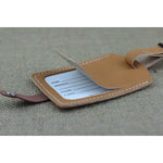Tan leather luggage tag for travel, customizable leather luggage tag for stylish identification