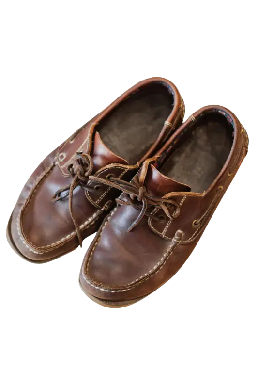 Pair of brown leather shoes on a white background 