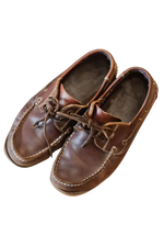 Pair of brown leather shoes on a white background 