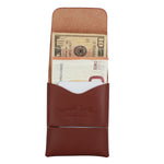 A brown leather card holder wallet with a tan interior pocket holding US dollar bills and Euro notes, shown against a plain white background. The front pocket is embossed with the brand name 'Toprank Leather'. 