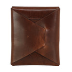 A brown leather envelope-style card holder or clutch with a diagonal fold-over flap, shown on a plain white background. 
