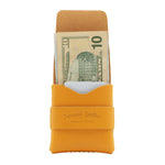 Yellow leather wallet with a card slot and money pocket on a white background 