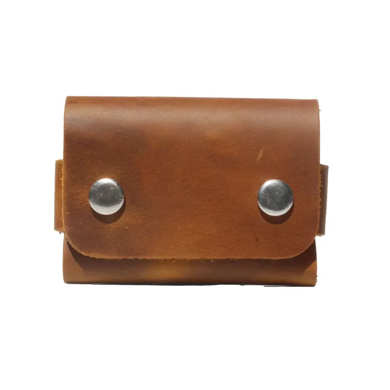 Durable metal snap button closure on the full-grain leather cardholder for secure and easy access.