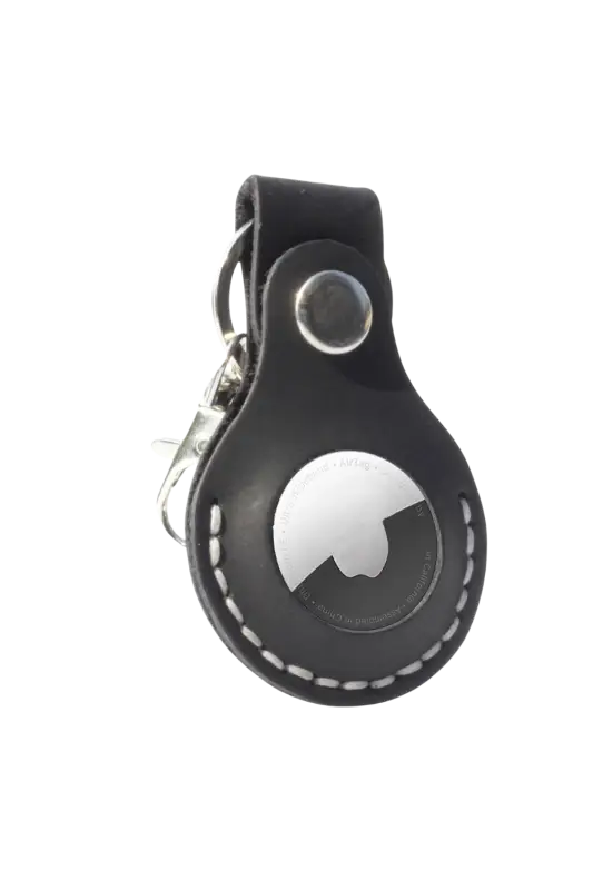 Black leather keychain with a silver tag on a white background 