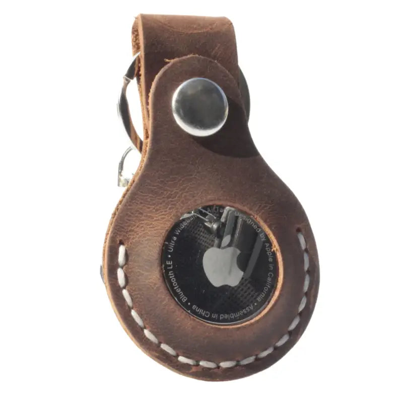 Brown leather AirTag holder for secure and stylish protection in genuine leather design