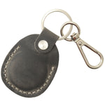 Black leather key fob with metal clip on a white background 