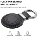 Black leather keychain with metal ring on a white background, featuring text about full grain leather durability. 