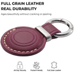 Purple leather keychain with silver ring on a white background, featuring text about full grain leather durability. 