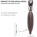 Brown leather case with metal clip for Apple Airtag, showing snug fit and no slipping. 