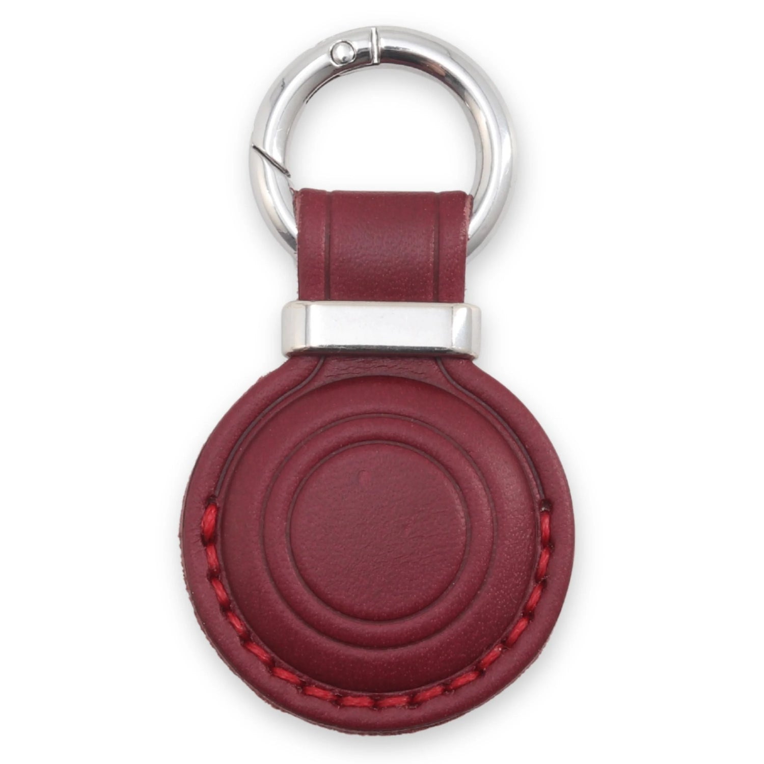 Red leather keychain with silver ring on a white background 
