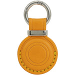 Orange leather keychain with silver ring on a white background 