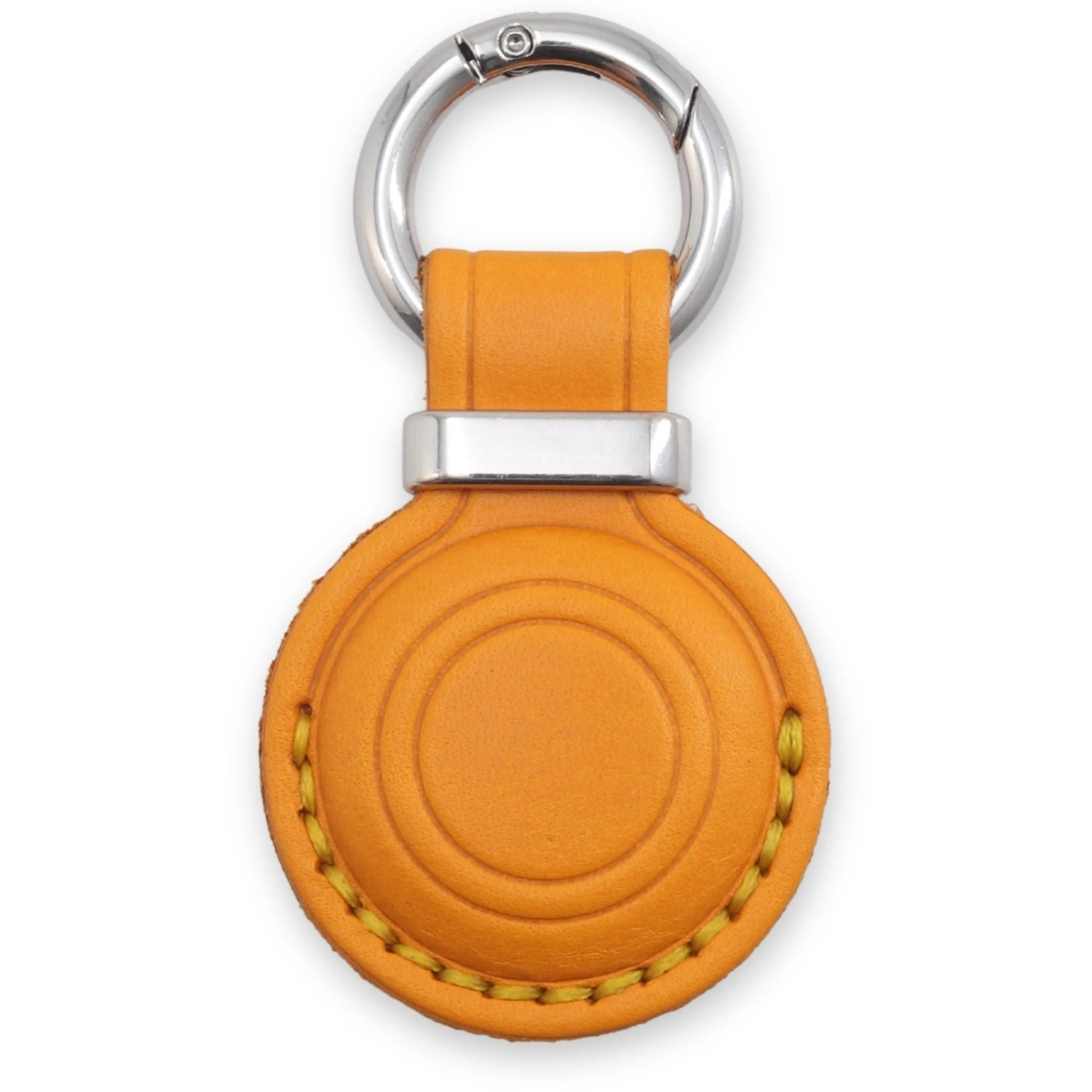 Orange leather keychain with silver ring on a white background 