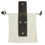 Canvas pouch with leather strap and metal grommets on a white background 