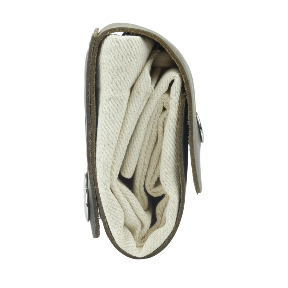 Folded blanket inside a green carrying case on a white background 