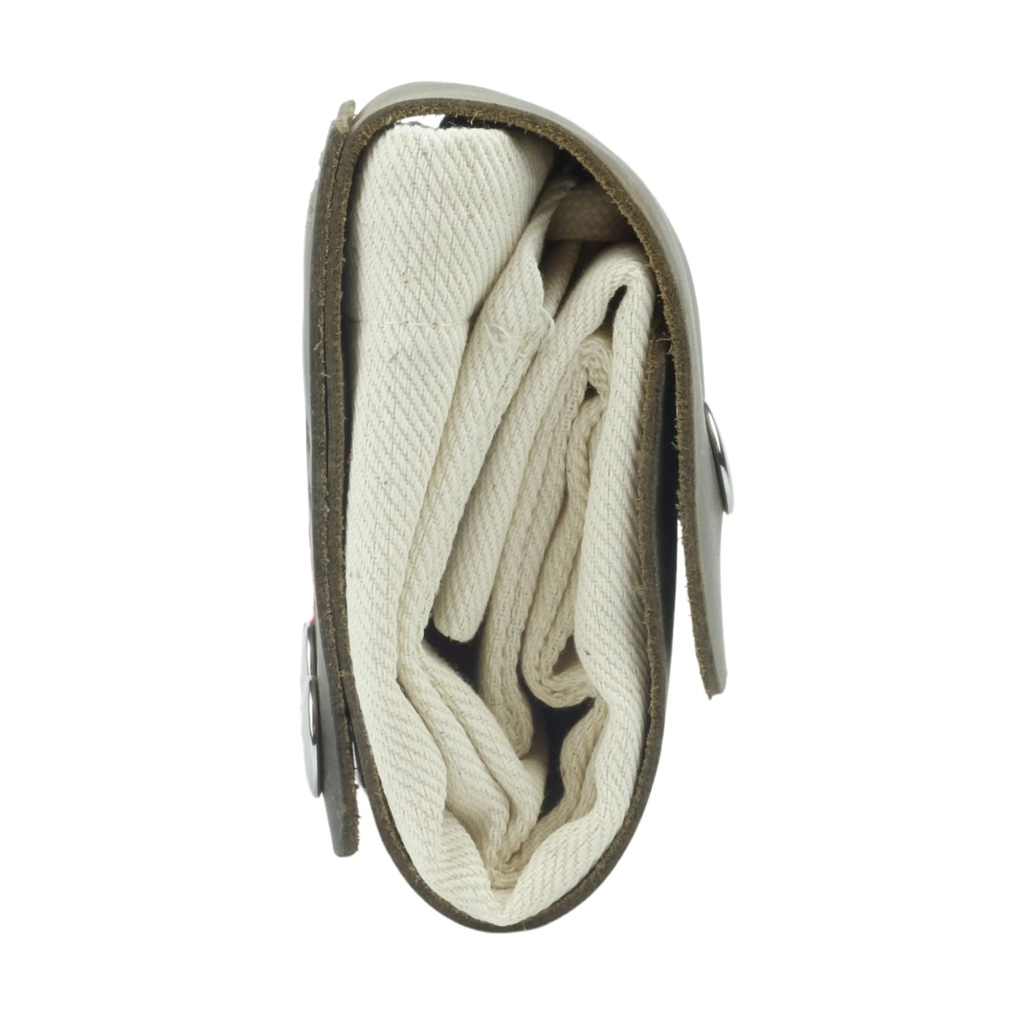 Folded blanket inside a green carrying case on a white background