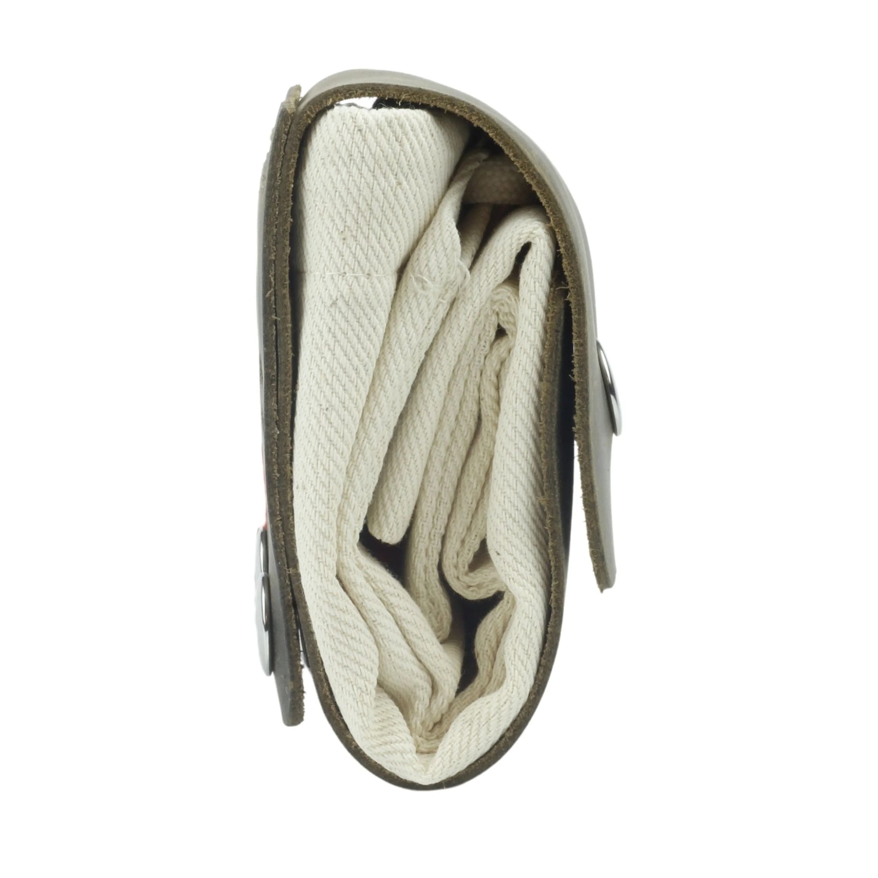 Folded blanket inside a green carrying case on a white background 
