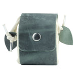 Green velvet pouch with drawstring and clear tube on a white background 
