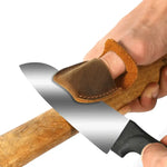 Leather thumb guard in use during a wood carving project, offering protection and comfort.