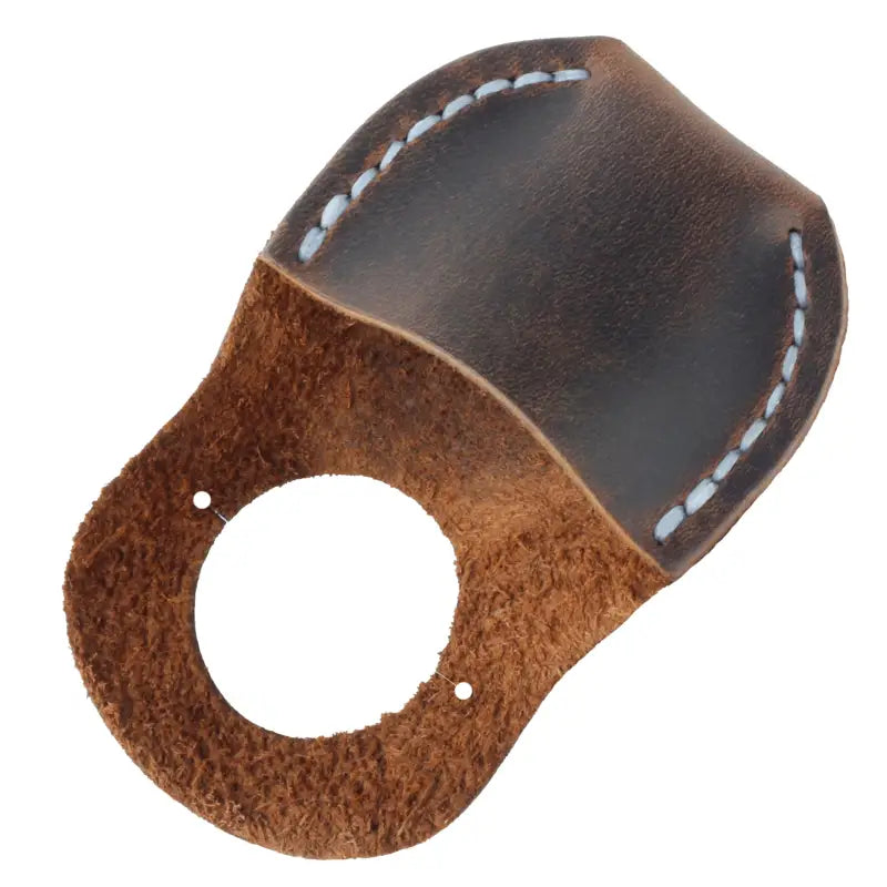 Brown leather finger grip for wood carving, enhancing carving safety with a leather thumb guard 