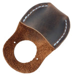 Tan-colored full-grain leather thumb guard, built to last for professional craftsmanship.