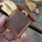 Brown leather coin purse featured in a Leather Wedding Ring Case for elegant storage