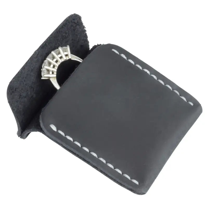 Black leather wedding ring case with white stitching for elegant jewelry storage