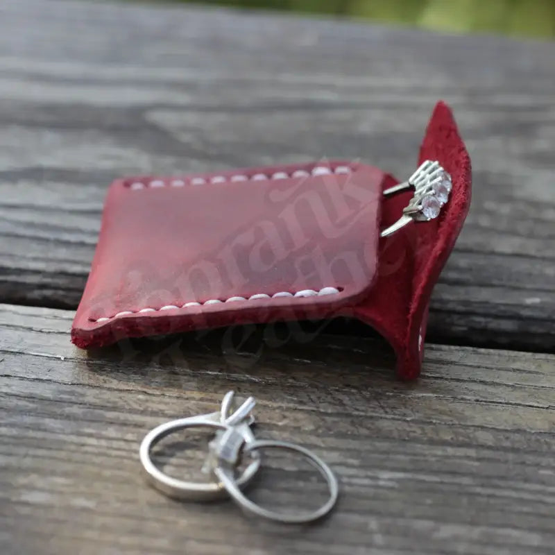 Burgundy leather key holder with metal rings in a stylish Leather Wedding Ring Case