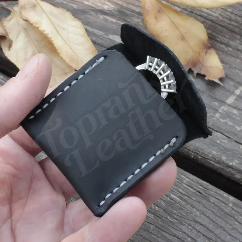 Black leather wedding ring case for elegant jewelry storage and protection