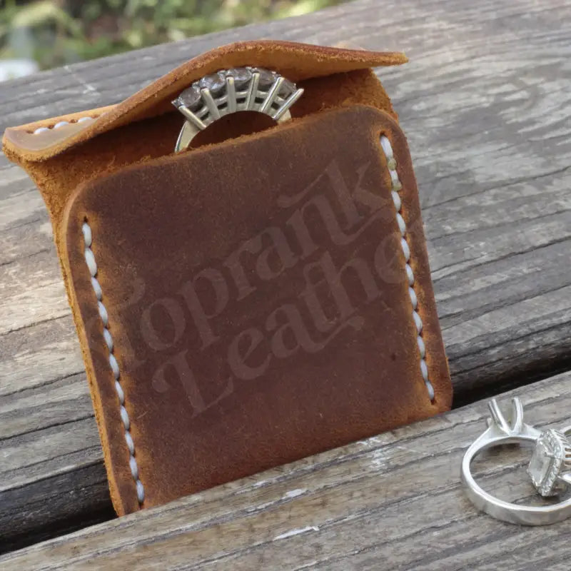 Leather Wedding Ring Case featuring a ring on a stylish leather ring holder