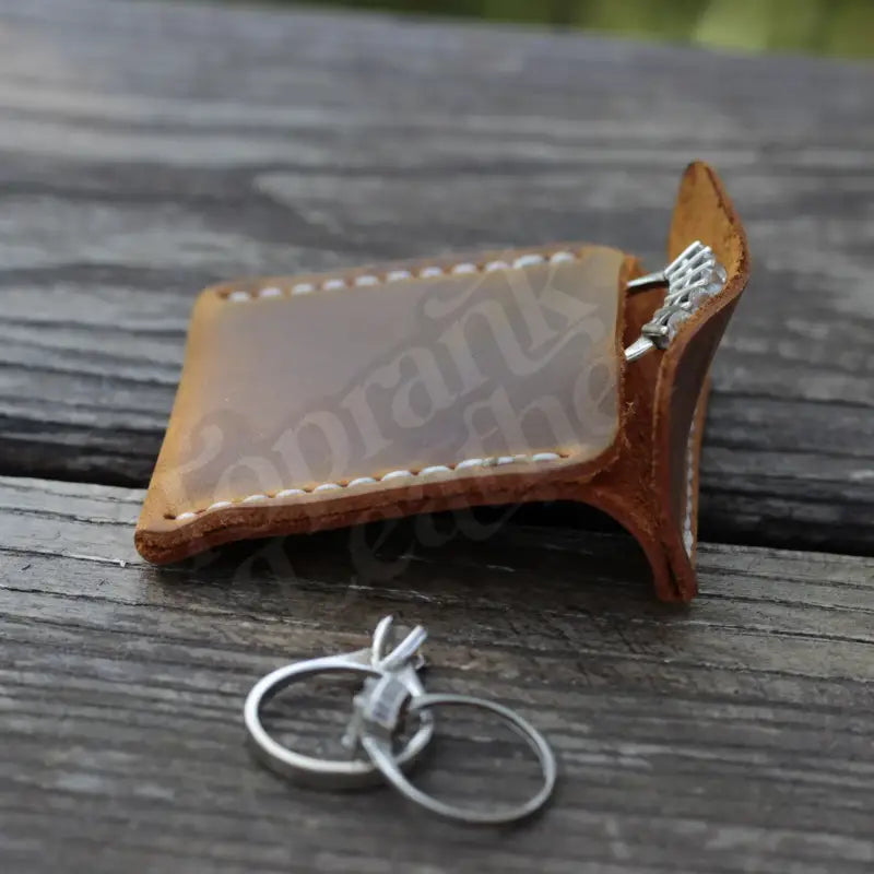 Hand-stitched brown leather key holder for secure storage in a Leather Wedding Ring Case