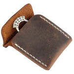 Brown leather wedding ring case with white stitching for elegant jewelry storage