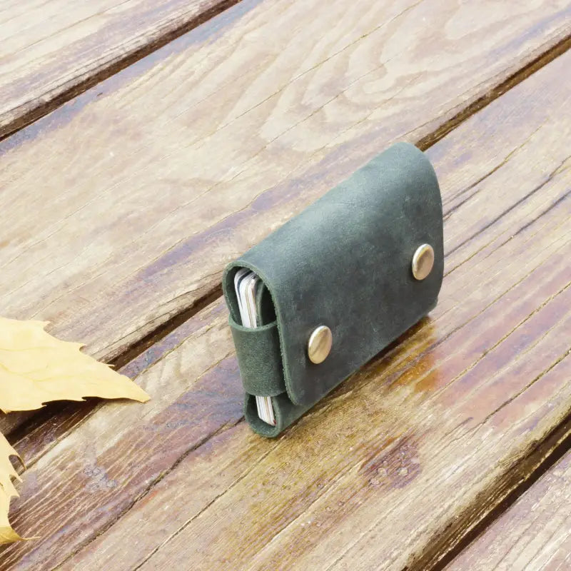 Dark green leather card holder wallet with brass buttons, stylish leather cardholder accessory 