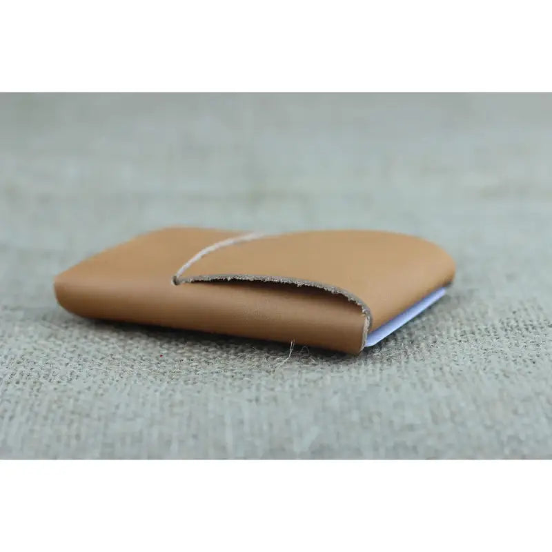 Ultra-Slim No-Stitch Wallet filled with credit cards and cash, showcasing its spacious yet ultra-compact profile for everyday use.