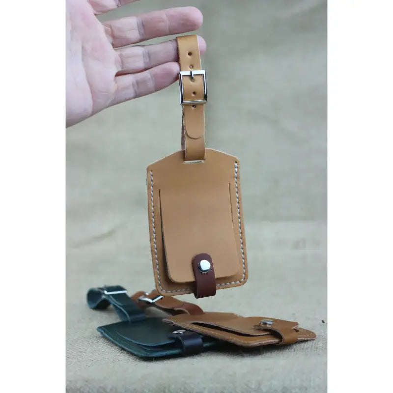 Leather Luggage Tag securely attached to a suitcase handle, ensuring easy identification during travel.