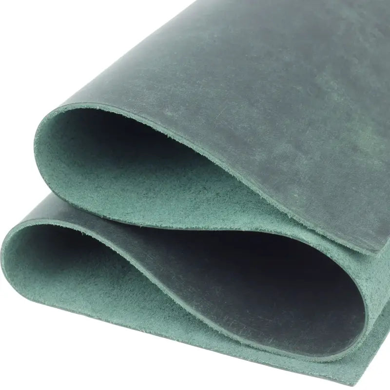 Folded green leather sheet for crafting, tooling leather, and veg tan leather projects 