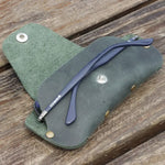 Green leather eyeglass case with glasses, perfect for slim sunglasses or eyeglasses