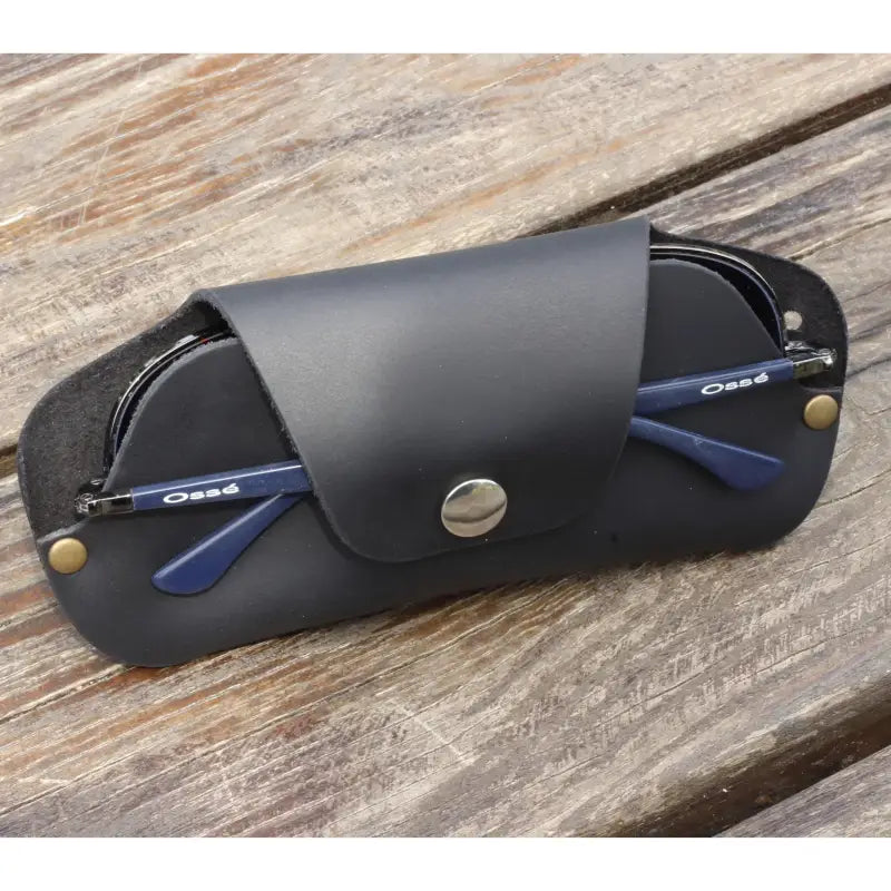 Black leather eyeglass case with blue glasses, a stylish slim sunglasses case