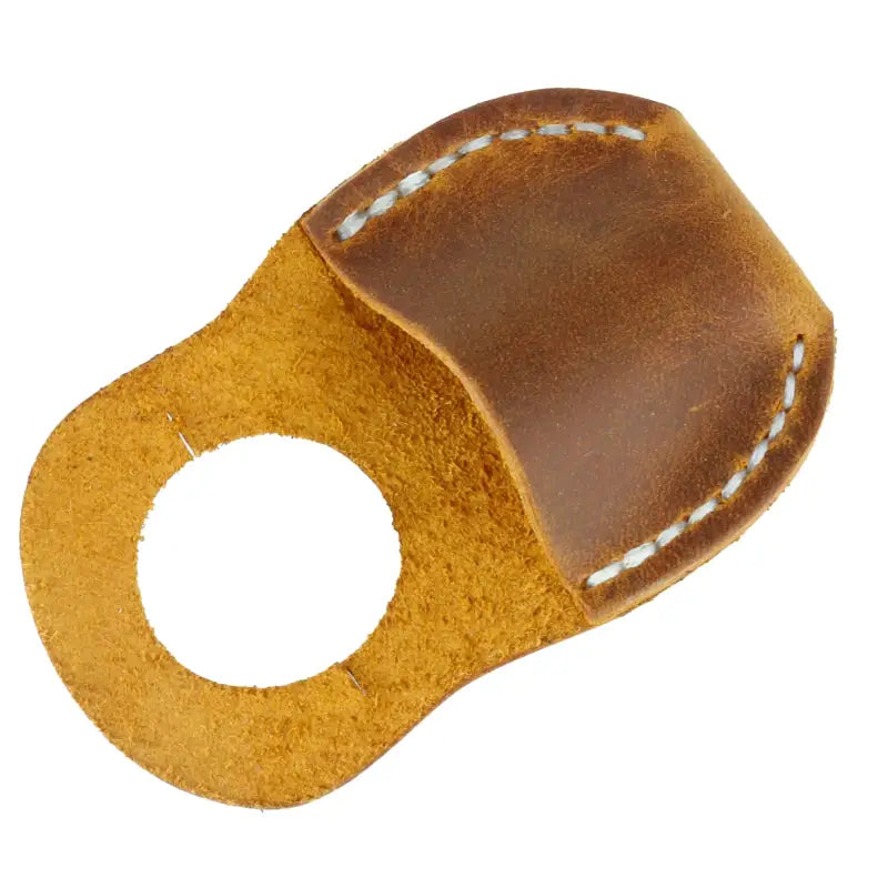 Handcrafted camel leather thumb guard with a durable rolled edge for woodworking safety.